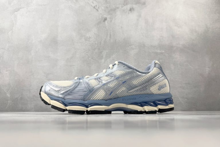 KITH x ASICS GEL-KAYANO 12.1 Loyalty Pack running shoes in Nebula Ice Blue Cream colorway — side view showing FluidRide midsole and GEL cushioning
