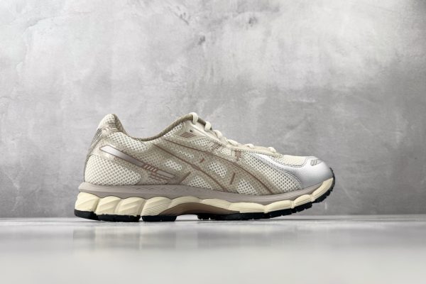 ASICS × KITH GEL-Kayano 12.1 medial side view showing GEL cushioning unit window and beige colorway upper construction