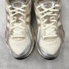 ASICS × KITH GEL-Kayano 12.1 top view displaying Chinese character tongue patch and KITH lace tag detail
