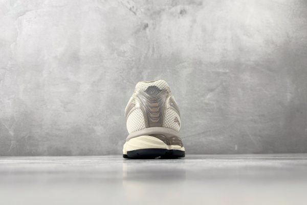 ASICS × KITH GEL-Kayano 12.1 rear heel view showing reflective ASICS logo overlay and GEL-Kayano 12.1 branding