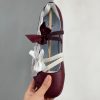 Dark Crimson PUMA ballet sneakers with lace panels and satin bows
