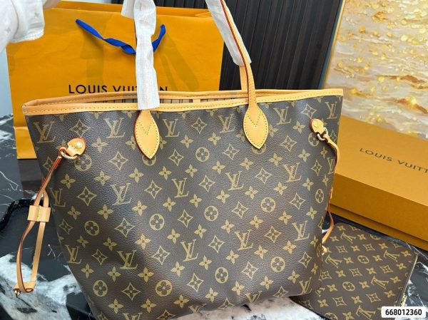 Back view of Louis Vuitton Neverfull MM tote with brown monogram pattern and natural-tone handles