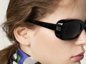 wsxc1787047969173_4 Model wearing Miu Miu black rectangle sunglasses with checkered scarf